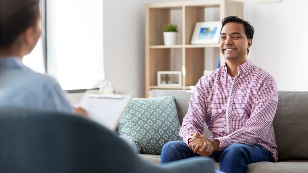 Man in therapy session, Pax Healing outpatient program for anxiety disorders.
